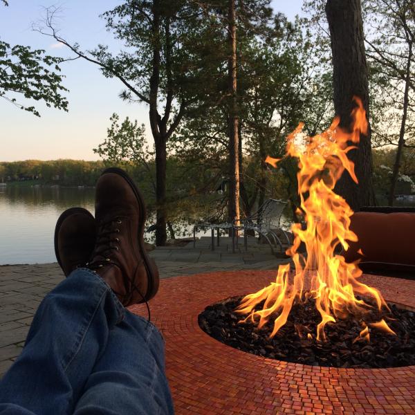 Person siting at fire pit